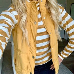 Golden Puffer Vest with versatile grey hood